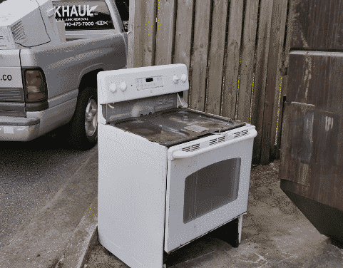 old stove and appliances in truck